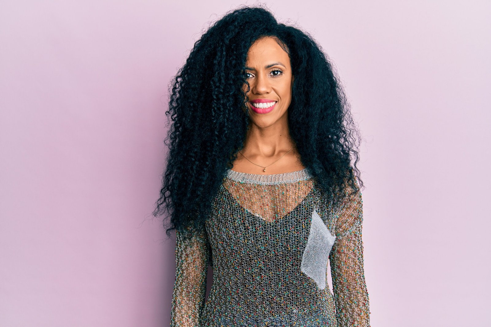 Middle age african american woman wearing casual clothes with a happy and cool smile on face. lucky person